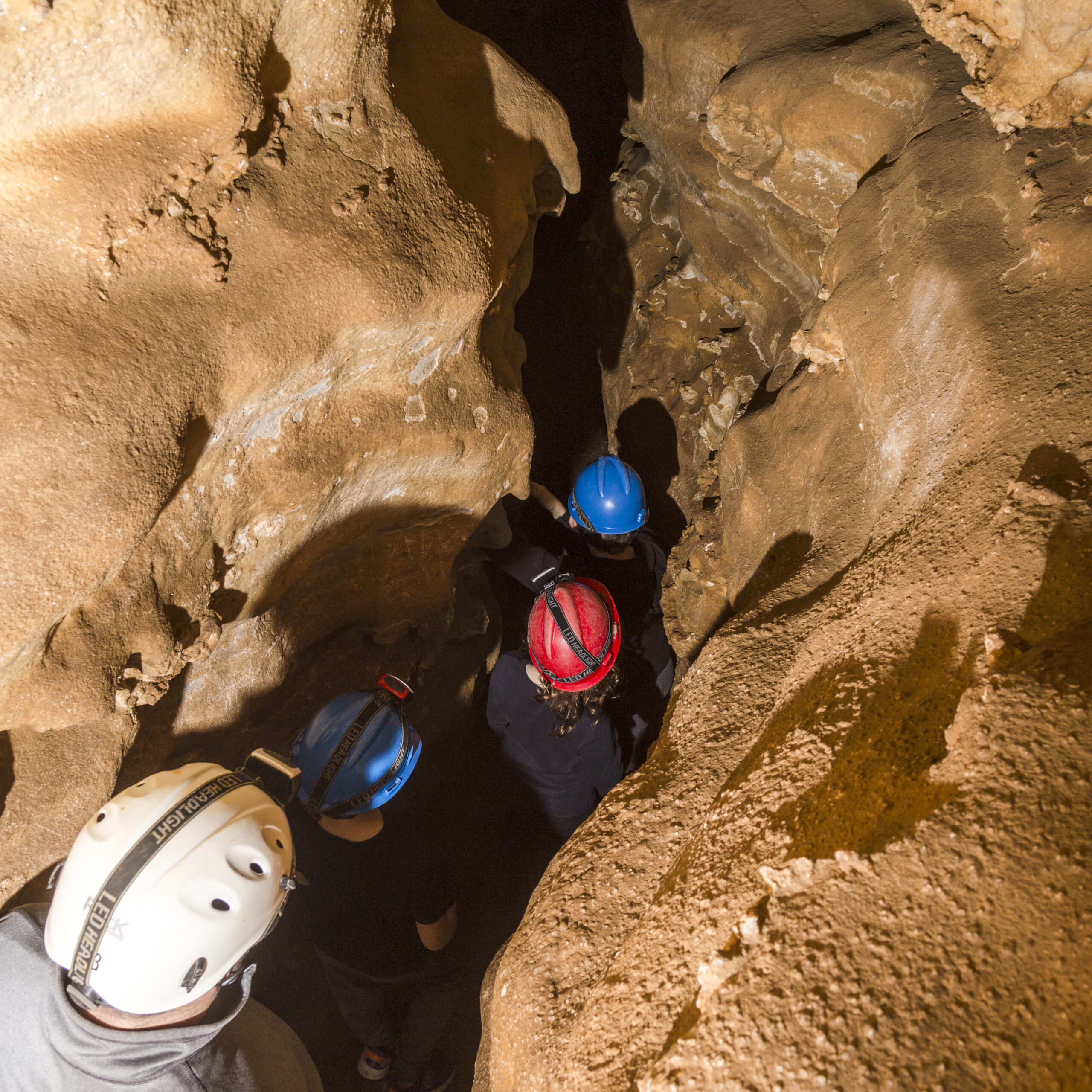 Family and Tour Guide Standing at Cave Entrance