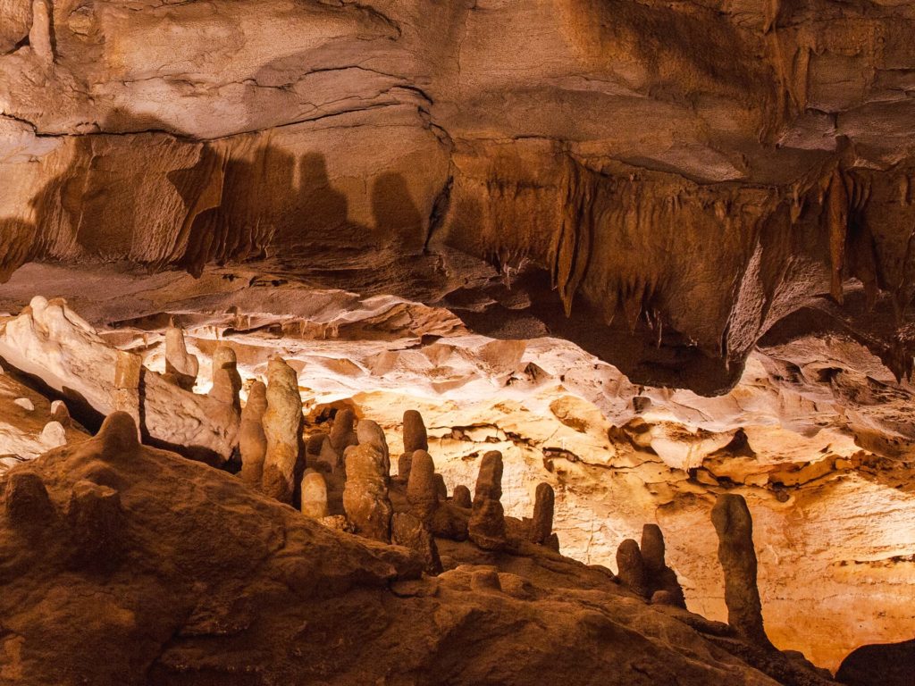 Illuminated rock formations inside the caverns