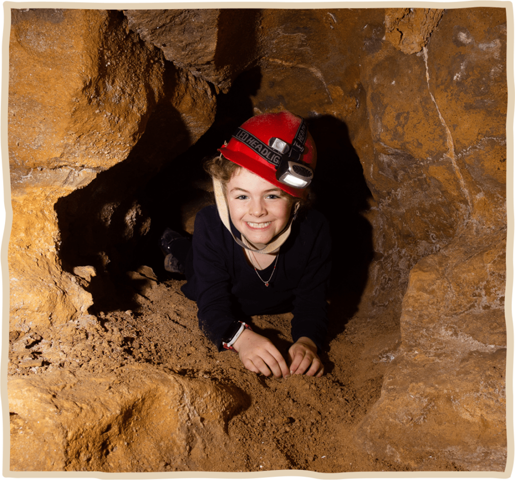 Smiling Young Girl in cave